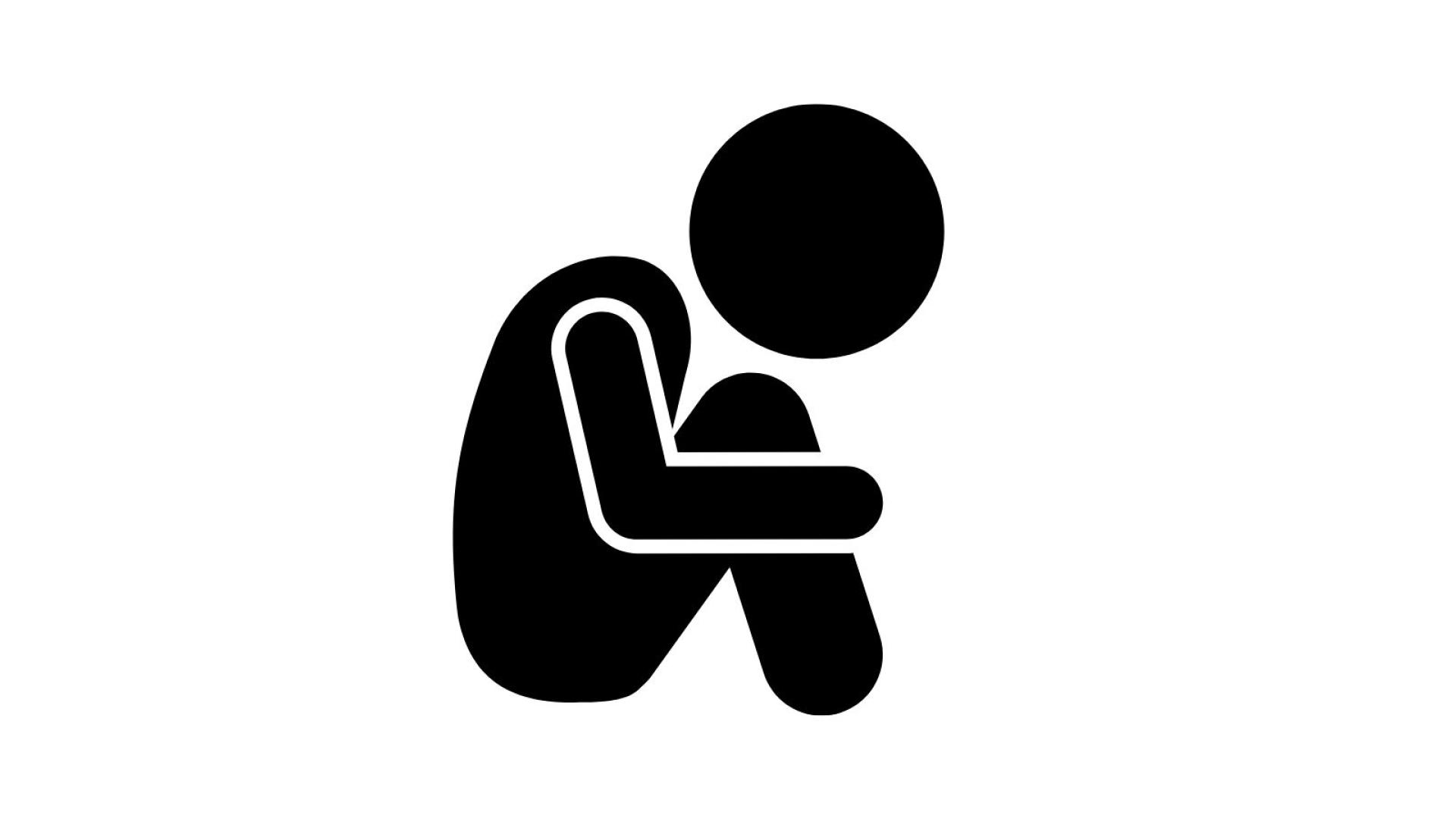 Graphic of person huddled holding their knees